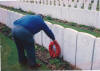 dad laying a wreath of poppies, with the centre showing the insignia of the Seaforth Highlanders