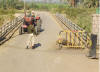 an armed officer stopping a tractor as we pass ..... !!