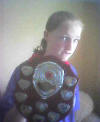 Katie, holding her football club's "Individual Player" shield, awarded for their 2003/4 season