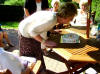 Mom's blows out the candles on her birthday cake