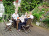 a relaxing morning reading the papers in their garden 